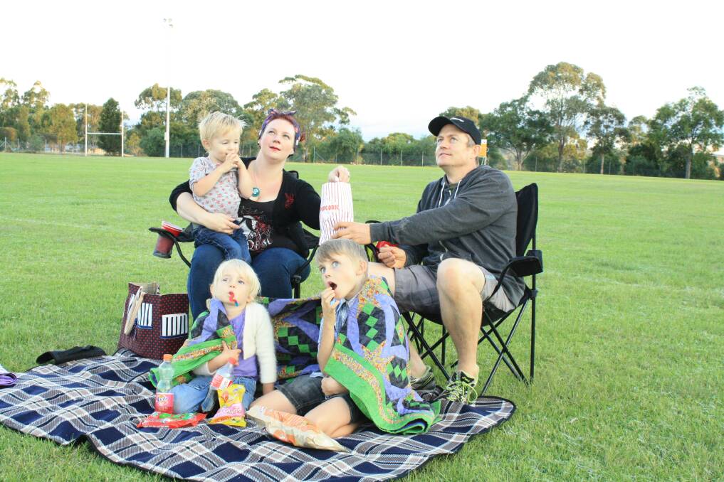 APRIL:POPCORN ANYONE? Muswellbrook families are pulling out their picnic blankets and warm winter jackets to be ready for the  open-air movie screenings in Muswellbrook and Denman. Four film nights will be held in the shire, starting on Sunday at Highbrook Park, as part of Muswellbrook Shire Council’s Blue Heeler Film Festival. Ange Dent and Nick Hagar are looking forward to taking Jack, 2, Isobel, 4, and Noah, 9, to the family-friendly events.