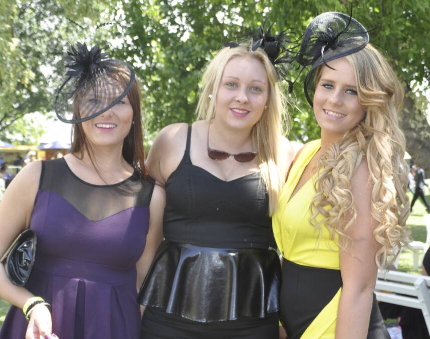 FASHIONISTAS: Muswellbrook’s Sophie Laing, Molly Miller and Jess Newton add plenty of colour to the Muswellbrook Cup meeting. 