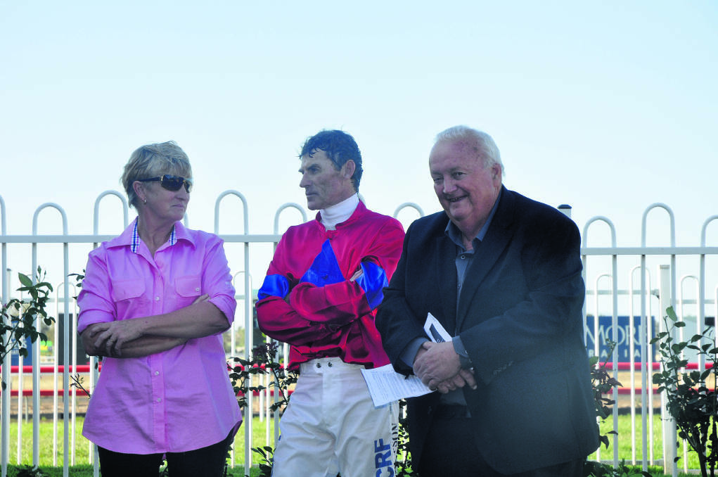 LENDING AN EAR: Ever-popular racing commentator Gary Harley eavesdrops on winning trainer Sue Grills and top hoop Robert Thompson while they discuss the victory of Darcey in the $20,000 Bengalla Mining Skellatar Sprint (1000m).
