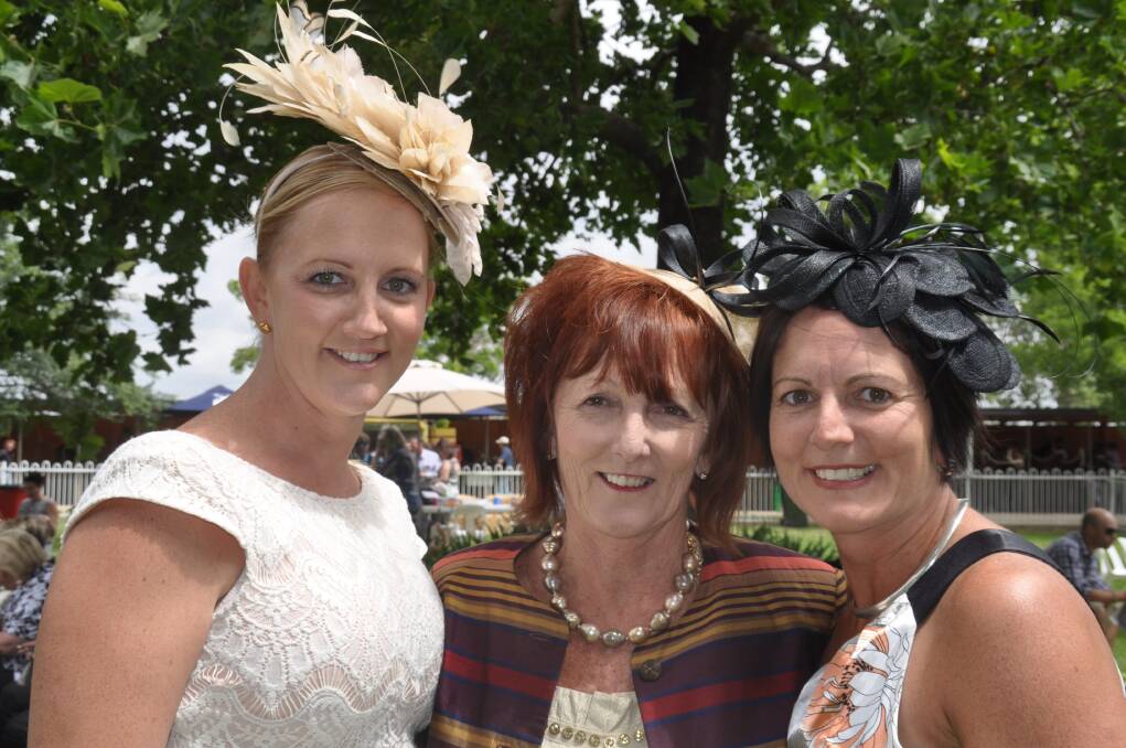 FAMILY OUTING: Cheryl Collins (Aberdeen) and her daughters Zoe (Denman) and Chelsea (Muswellbrook) at the Muswellbrook Cup meeting on Tuesday.
