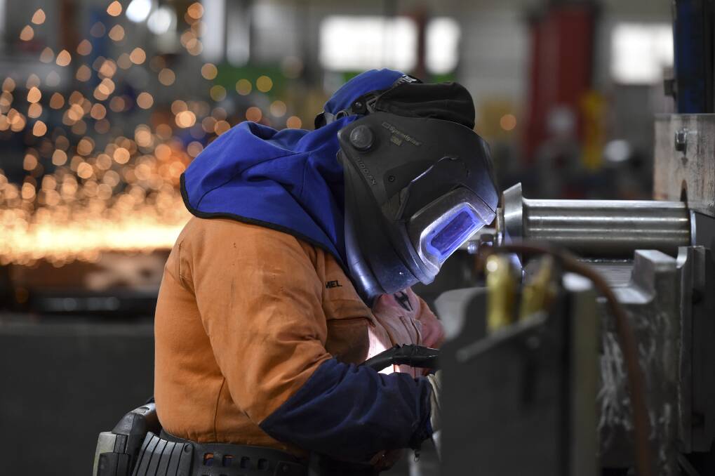 TOUGH: Mel welding at her job as a boilermaker at Hofmann Engineering Bendigo. Picture: NONI HYETT