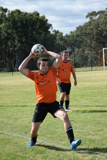 EAGLES: Taylor Windle (front) received the Reserve Grade side's 'Most Consistent' award for 2021. Supplied: Muswellbrook Eagles FC