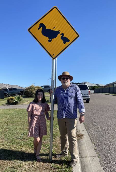 DUCKS CROSSING: 10-year-old Lissa Anderson with Muswellbrook Shire Council Mayor Rod Scholes next to a newly installed 'ducks crossing' sign on Osborn Avenue, Muswellbrook on Wednesday, October 27. Picture: Mathew Perry