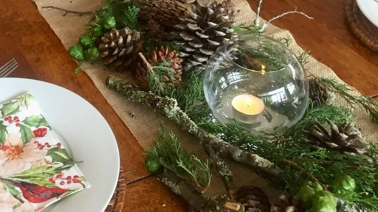 Pine cones and foliage are simple but beautiful ways to decorate the Christmas table. Picture supplied 