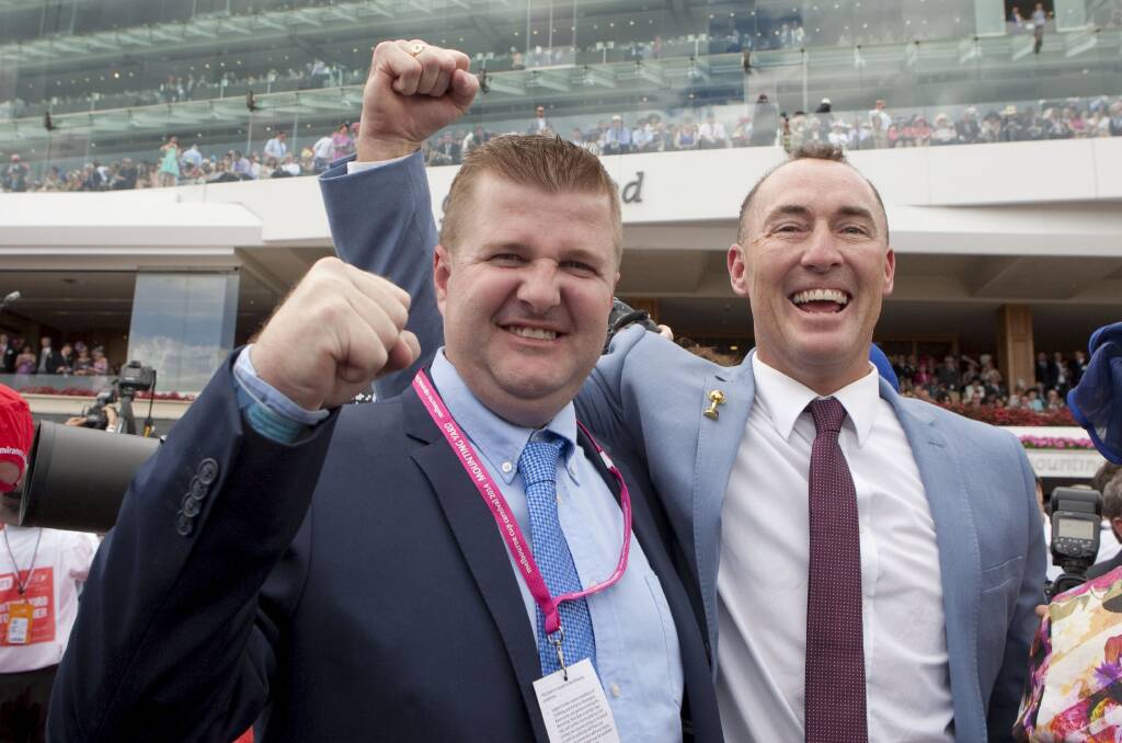 ON TOP: Australian Bloodstock syndicators and part-owners Luke Murrell and Jamie Lovett celebrate after Protectionist's victory in the 2014 Melbourne Cup.