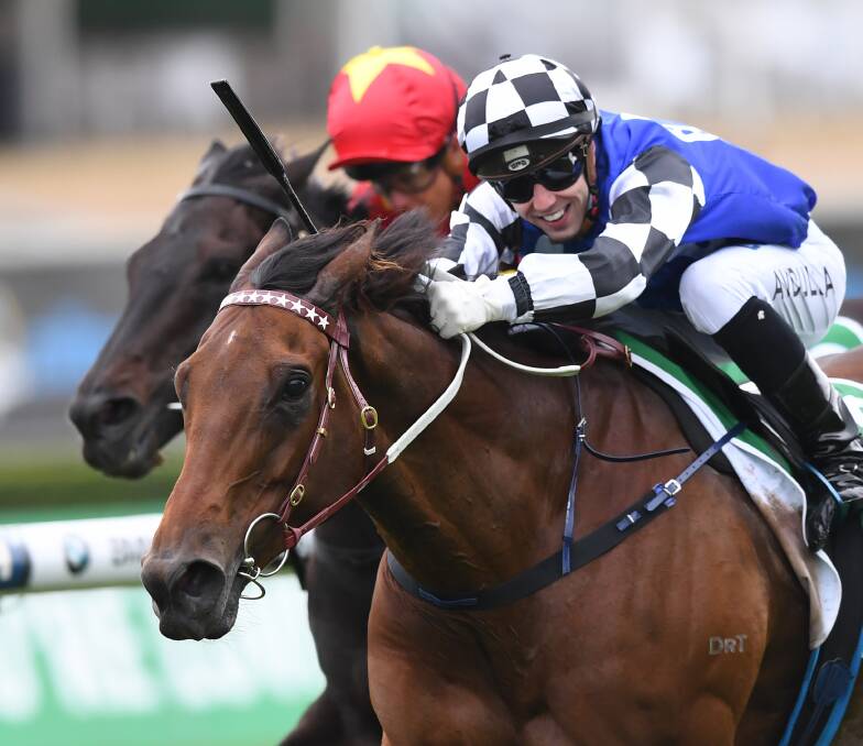 WINNER: Brenton Avdulla rides Big Duke to victory in the St Leger Stakes. 
Picture: AAP