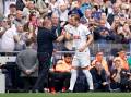 Tottenham's Harry Kane with manager Ange Postecoglou after being substituted during a pre-season friendly on Sunday. Picture Gettys