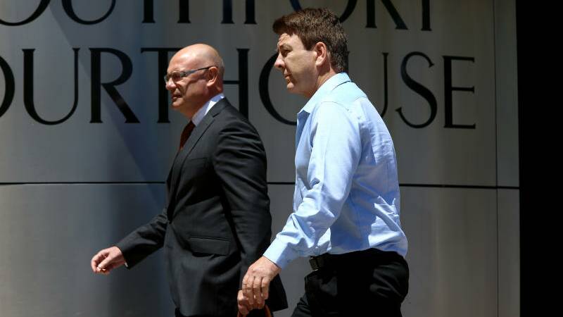 Dreamworld Head of Engineering Chris Deaves (right) arrives at the inquest into the Dreamworld disaster at Southport Court. Photo: AAP Image, David Clark