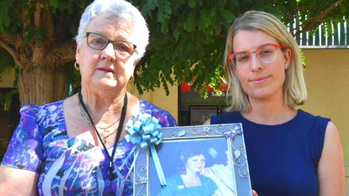 Hoping for answers: Margaret Carver and Mandurah Mail journalist Carla Hildebrandt, holding a picture of Annette Deverell. Photo: Gareth McKnight. 