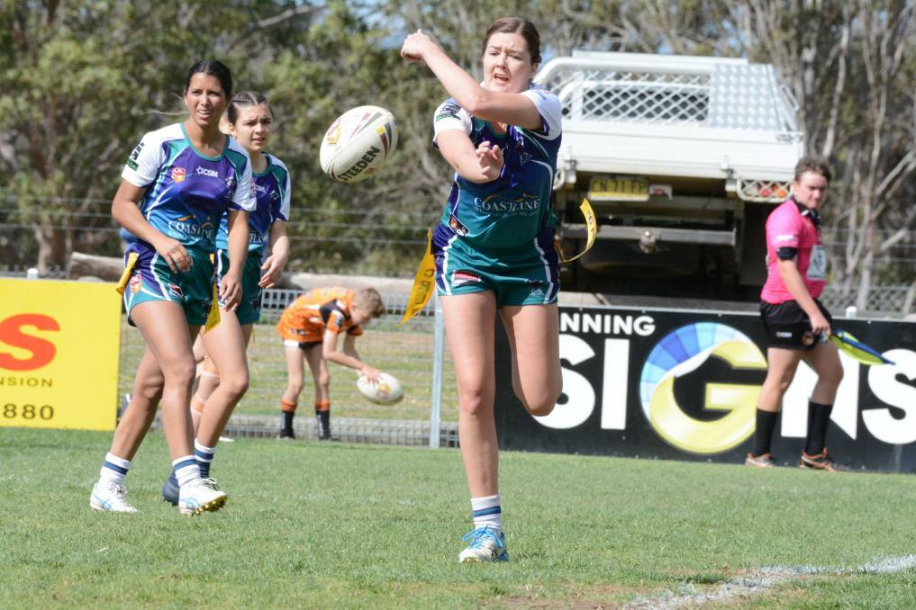  Taree City's Kelsey Schneider fires out a pass during a league tag clash in the 2019 Group Three season.
