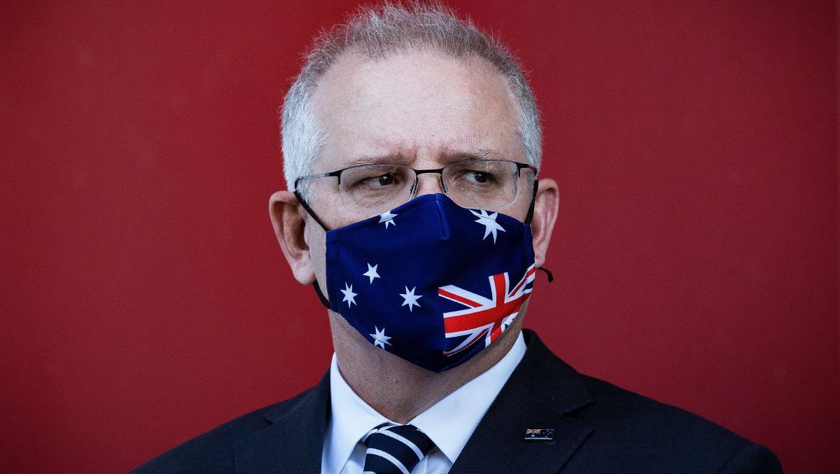 Prime Minister Scott Morrison has been instructed to wear a face mask while working during the 14 days of his special exemption from the ACT government. Picture: Getty