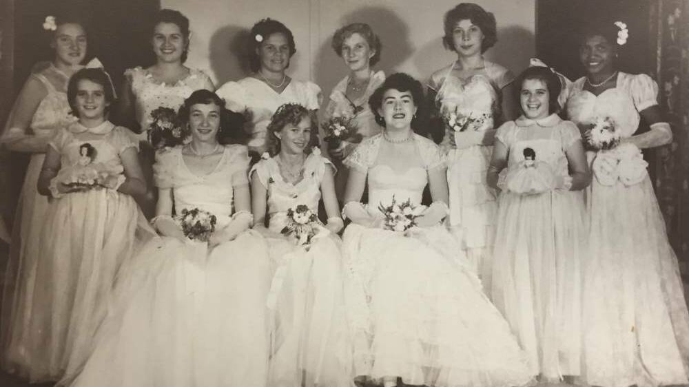 At one of the first debutante balls in Katherine, just nine girls partnered up and were presented with two young flower girls.