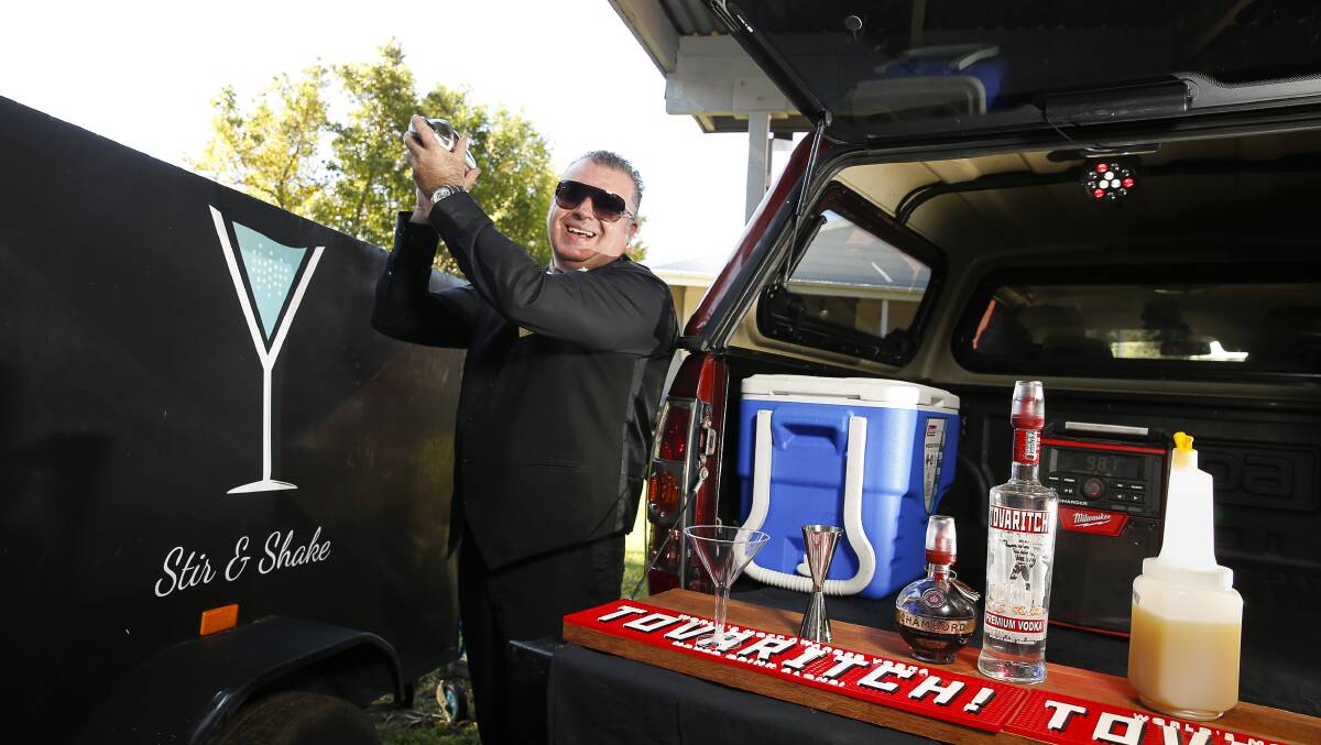 Armed with a stocked ute and drinks mixing equipment, Mr Calleja has ventured out into Wollongong's suburbs to serve cocktails straight to people's driveways. Picture: Anna Warr.