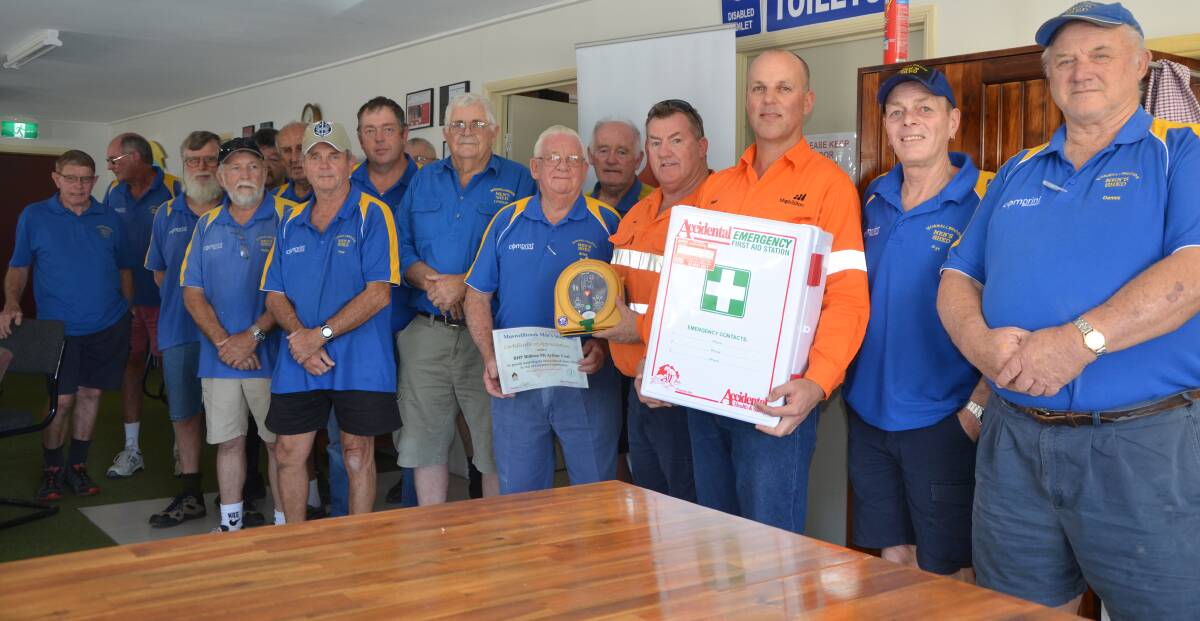 ADDED BONUS: Members of the Muswellbrook Men’s Shed with BHP Billiton’s Mick Hanly and Nigel Smith and the new first aid kit and defibrillator. 