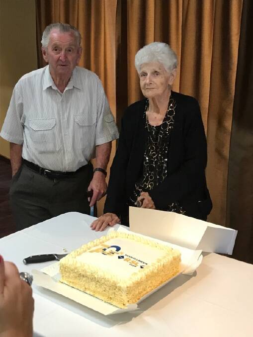 MUCH TO CELEBRATE: Former Muswellbrook RSL Club staff member Martin Blenman and club patron Marie Elks cut the 70th birthday cake.