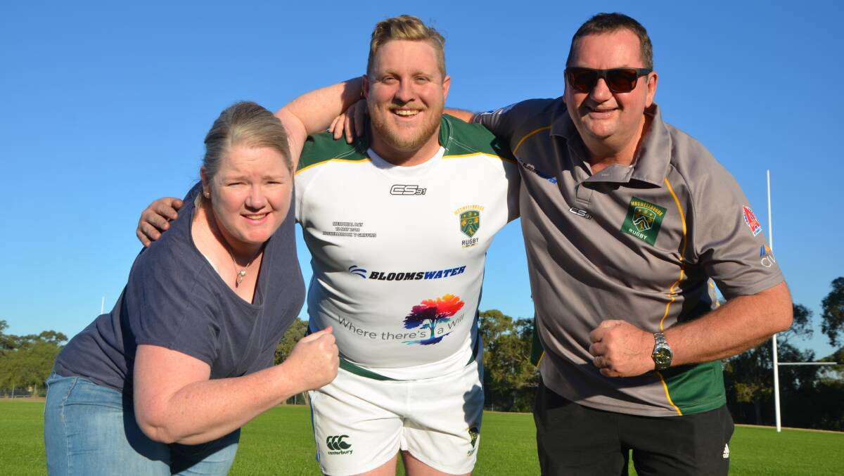 PARTNERSHIP: Where There's A Will's Andrea Burns with Muswellbrook Heelers captain Harry Hobden and president Greg Buckley.