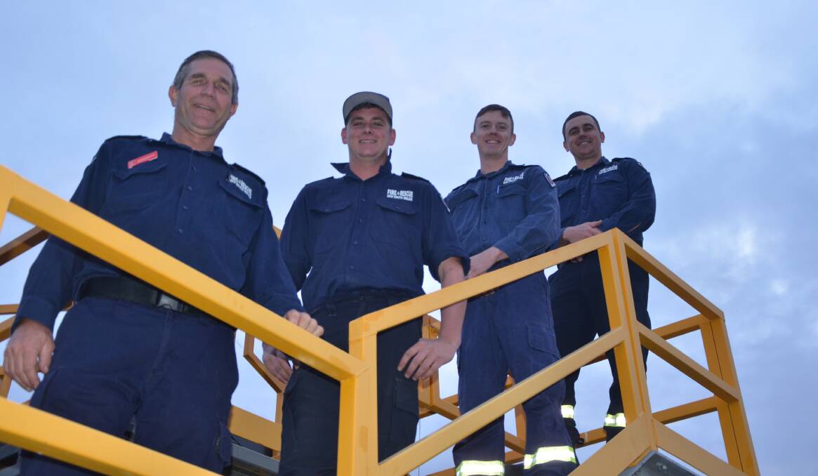 ON FIRE: Denman Fire and Rescue NSW crew members Steve Kendall, Richard Wilkins, Logan McKenzie and Amon Burkill are training for the upcoming Firies Climb for Motor Neurone Disease in Sydney.
