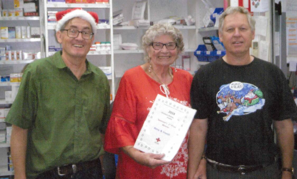 FESTIVE RESULT: Judge Jennifer Lecky with Ken Berry and Richard French from the Berry and French Pharmacy.