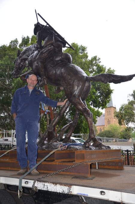 PROUD AS: Artist Brett “Mon” Garling with his latest work, Over the Top, which will be officially unveiled during the Battle of Beersheba 100-year anniversary commemorations at Muswellbrook on Tuesday.