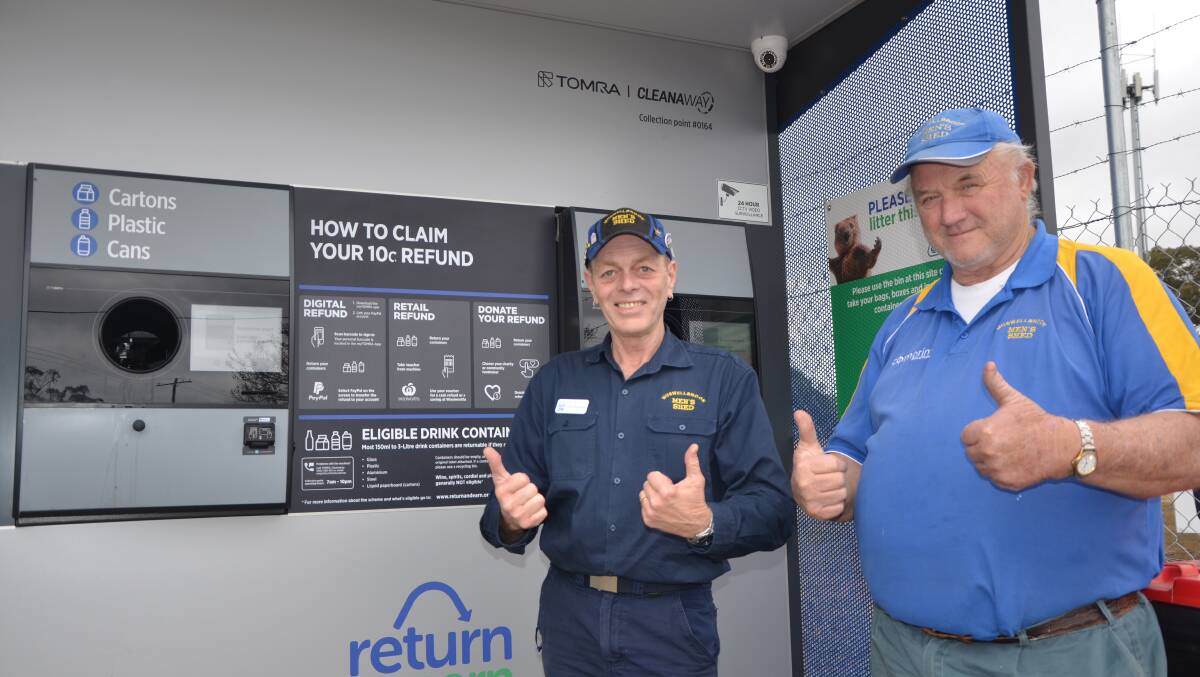 BENEFICIARY: Muswellbrook Men’s Shed members Dave Sorensen and Dennis Matthews at the Muswellbrook RVM (reverse vending machine) on Sydney Street. 
