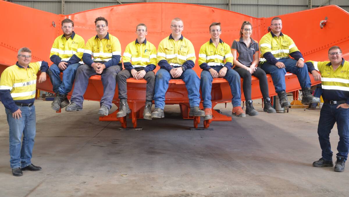 BRIGHT FUTURE: MRS Services Group chief operating officer Jonathon McTaggart (left) and chief executive officer Paul Brenton with apprentices Jesse Baker, James Howard, Lachlan Barry, Clinton Mackie, Matthew Eustace, Maddison Williams and Kobey Adam-Smith. Absent: Isabella Sheehan