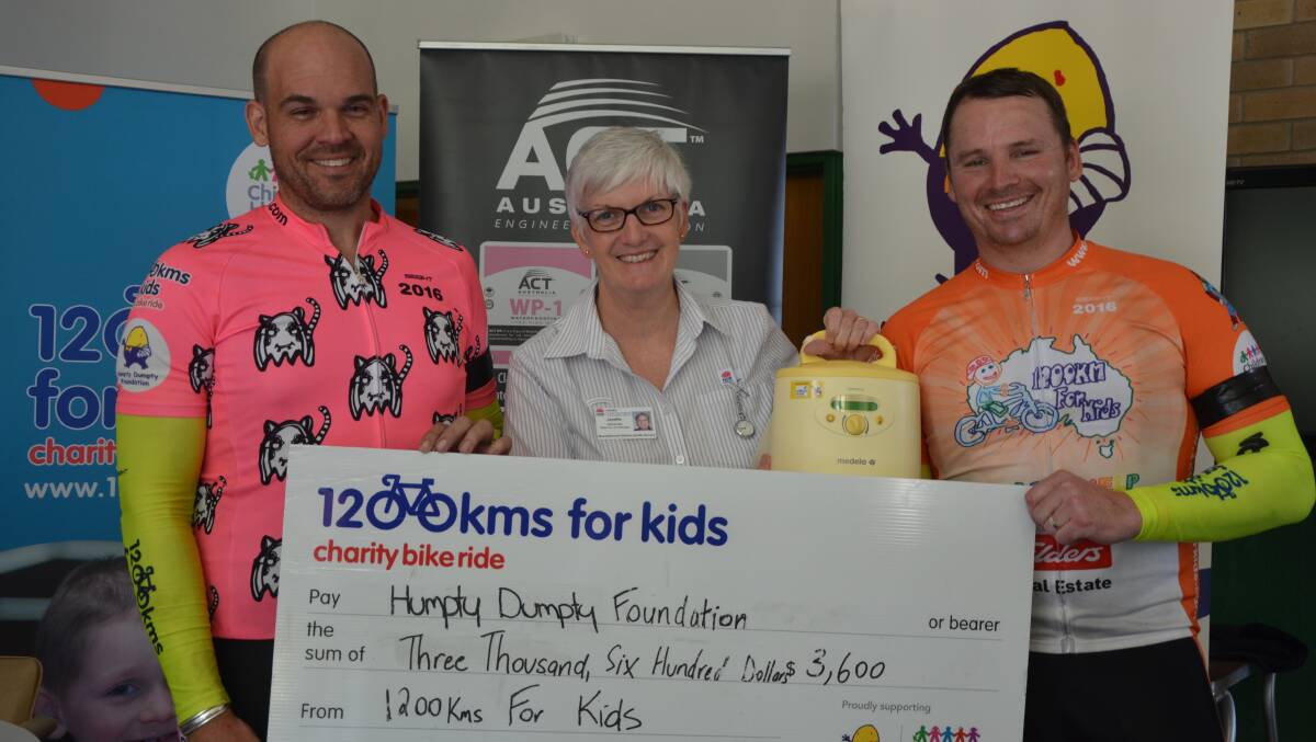 THANK YOU: 1200kms for Kids riders James Strong and Ed Jackson with an appreciative Muswellbrook Hospital maternity unit manager Janelle Alexander on Thursday.