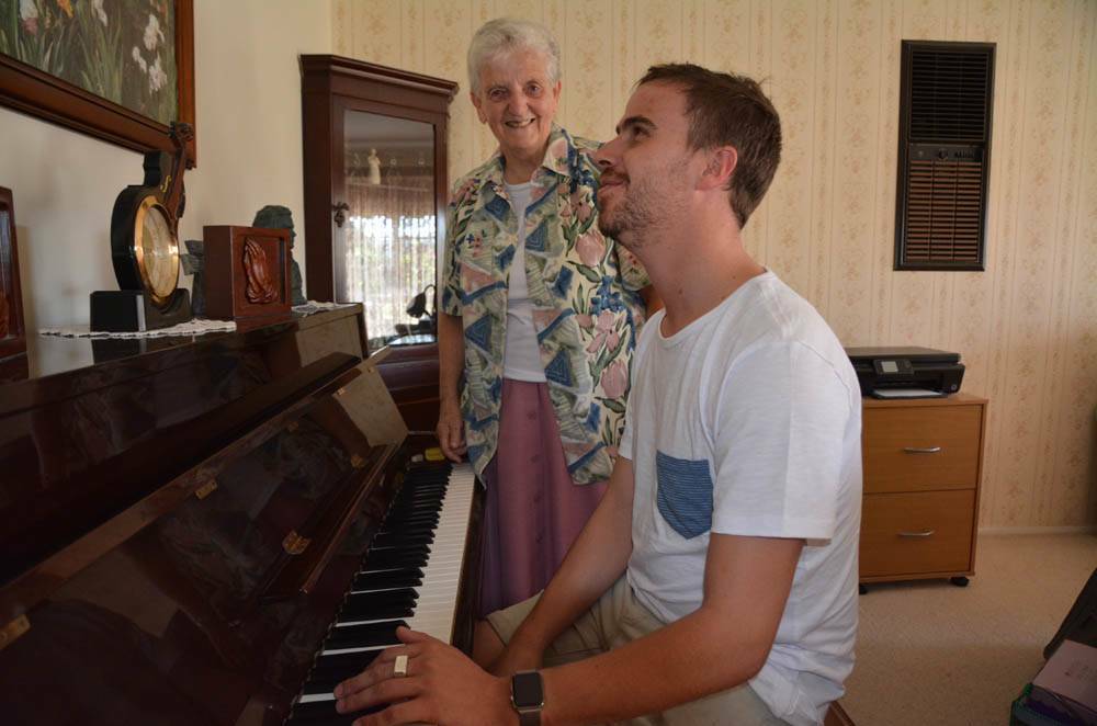 MEMORIES: Sister Dorothy and Matt McLaren revisiting their lessons. This is the same piano from his childhood lessons.