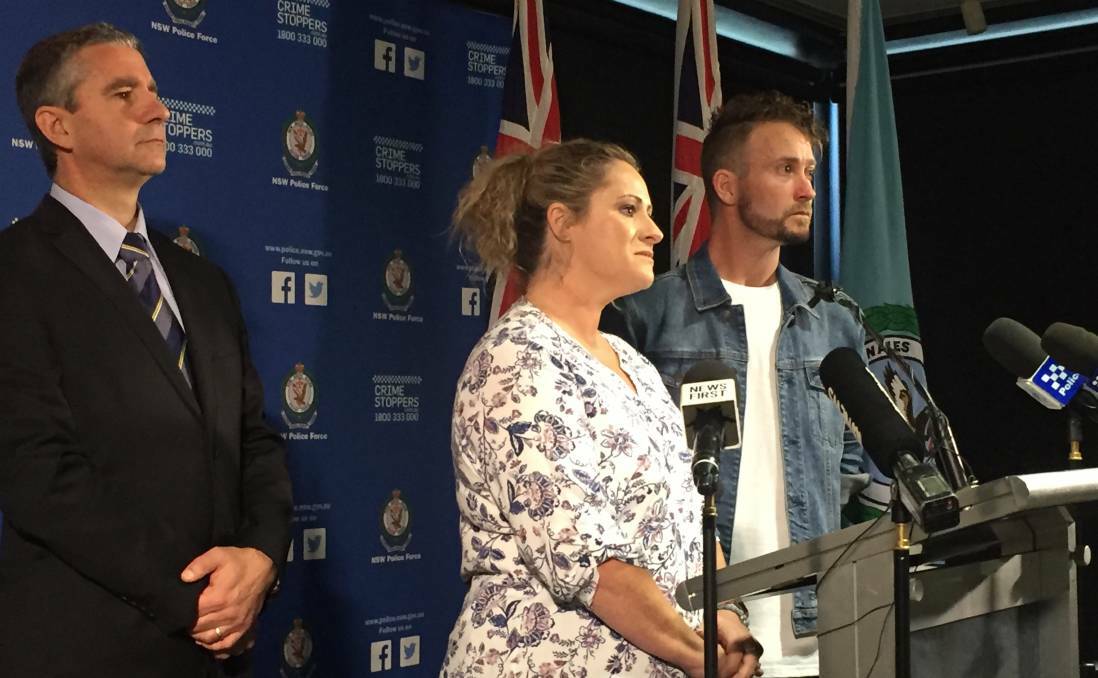 REWARD: Superintendent Scott Cook with Janine Vaughan's sister Kylie Spelde, of Musewellbrook, and brother Adam at a press conference in March, 2019, where police announced a $1 million reward.