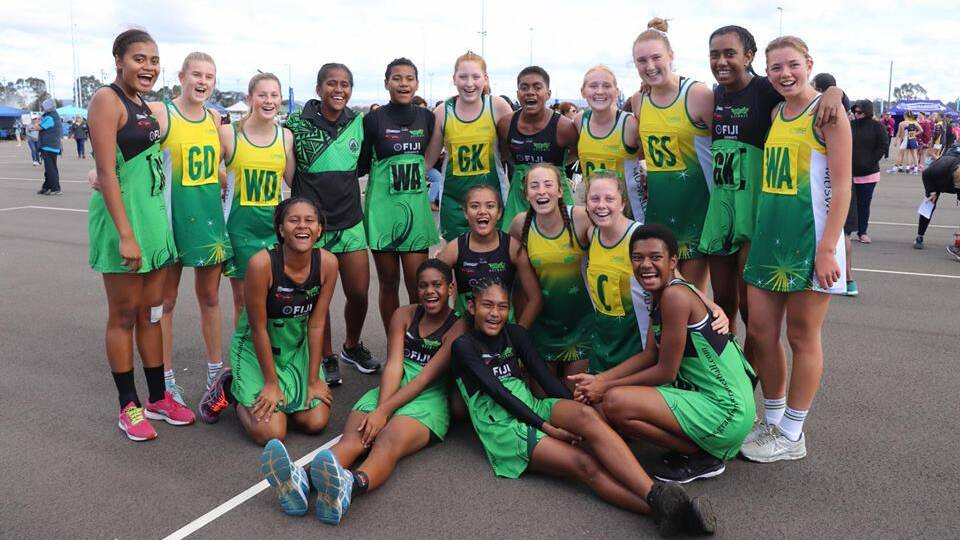 FRIENDSHIP: The Muswellbrook Netball Association's under-15s with players from invitational side, Grasshoppers Fiji, at the 2018 Netball NSW State Age Championships.