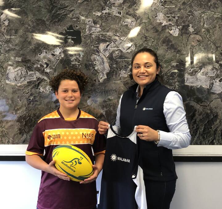 BRIGHT FUTURE: Junior rugby player Louis Bottomley and Malabar Coals manager environment and community Donna McLaughlin.