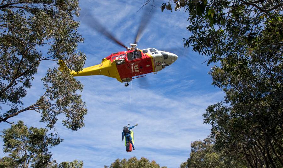 Injured woman winched to safety