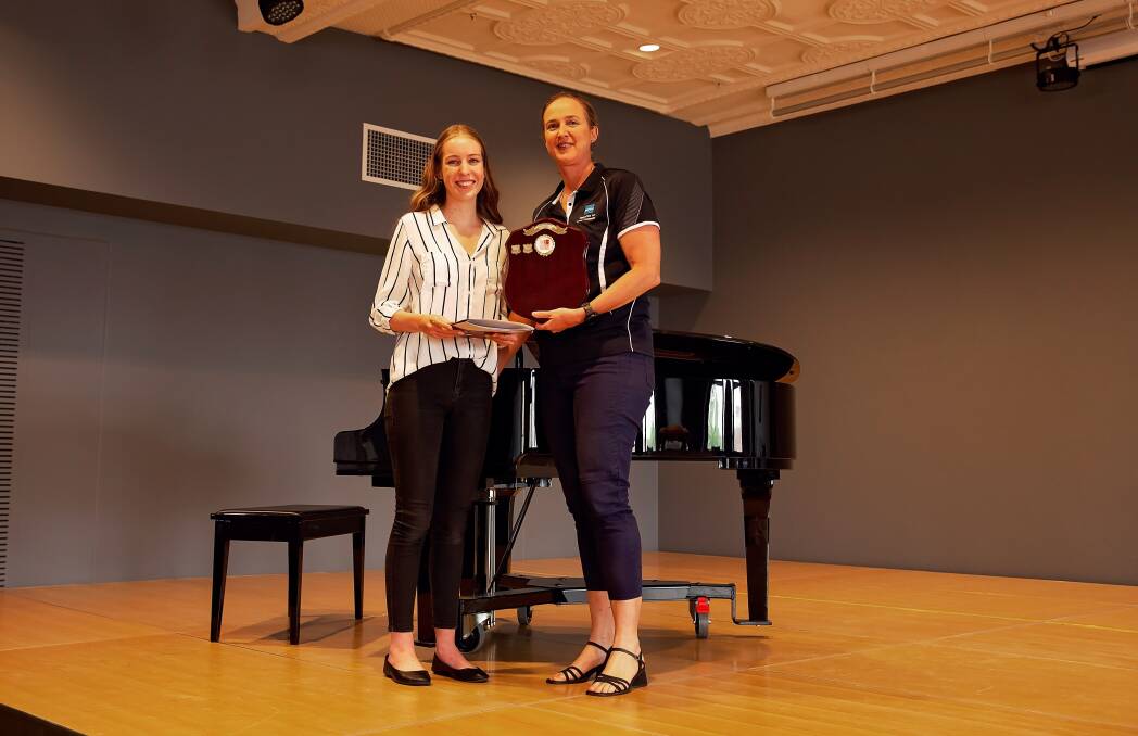 Bengalla Peter Riddy Memorial Scholarship winner Holly McDonald is presented with her award by Fiona Hartin (Bengalla)