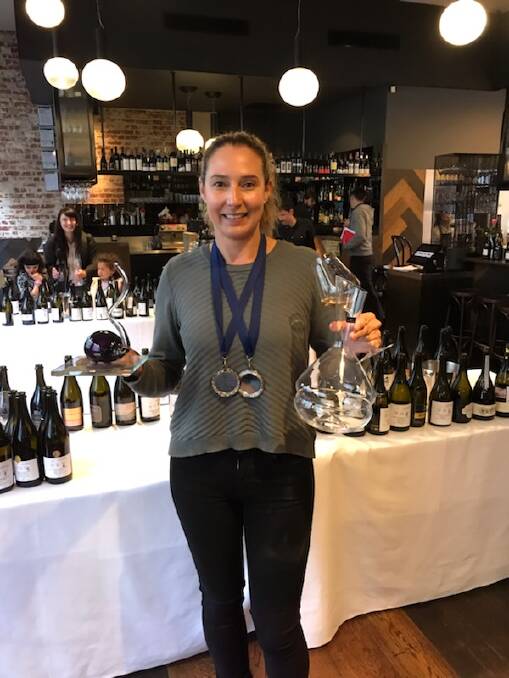 TRIPLE TREAT: Hollydene Estate business manager Emma Williams at the Australian Sparkling Wine Show in Melbourne.