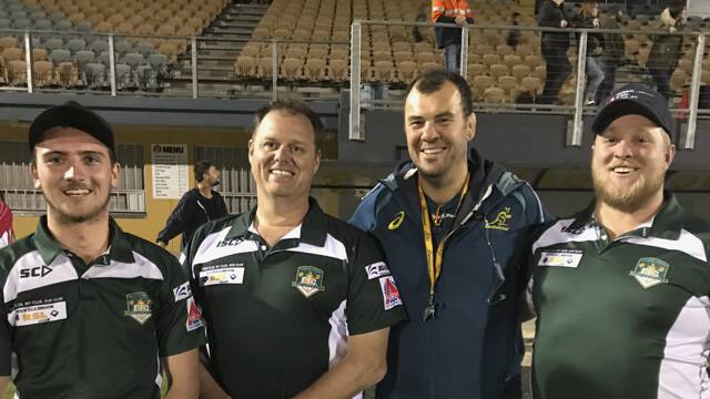 Muswellbrook Heelers Cameron Young, Michael Hall and Harry Hobden with Wallabies coach Michael Cheika at the national team’s training session at Cessnock