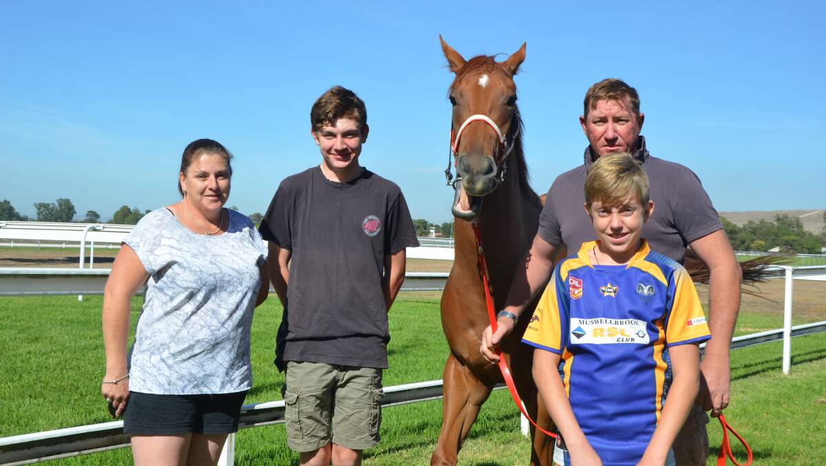 FAMILY TIES: Muswellbrook trainer Andrew Robinson with wife Cathy, sons Michael and Nick, and record-breaking mare Barr Hill. Pic: ROD THOMPSON 