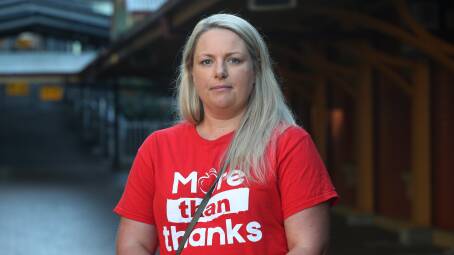 Amber Chapman at Wollongong Train Station before departing for Sydney to join the strike action protest. Picture: Robert Peet