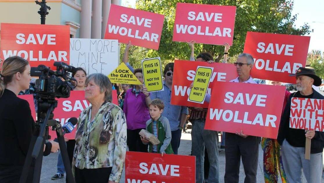 Protests: Wollar residents stage a protest outside a NSW Planning Assessment Commission hearing considering expansion of Wilpinjong coal mine.