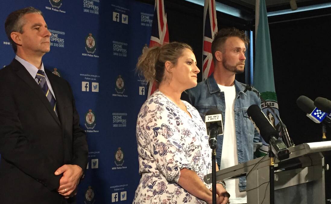 REWARD: Superintendent Scott Cook with Janine Vaughan's sister Kylie Spelde and brother Adam at a press conference in March, where police announced a $1 million reward.