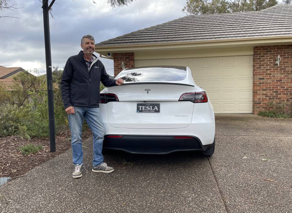 Michael Thompson brought one of the first Teslas to arrive in Australia - and still has the original plate. Picture by Elesa Kurtz