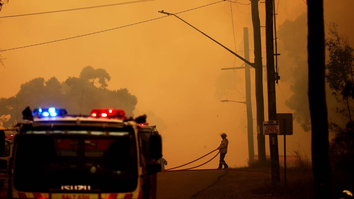A destructive bushfire at Kurri Kurri on December 14 last year. Picture by Peter Lorimer