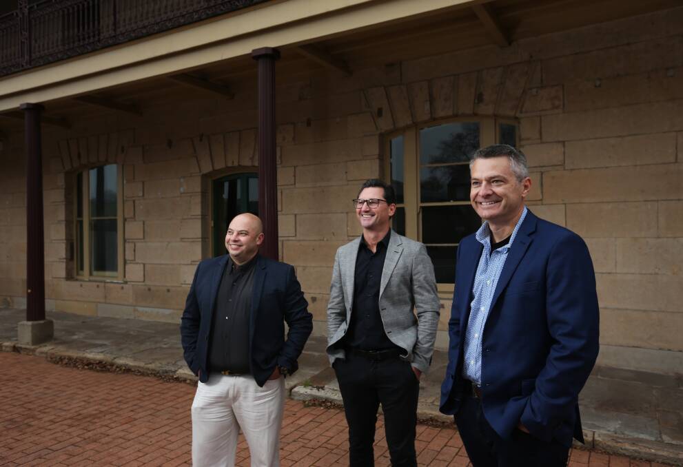 Innovation precinct: The Melt founder Trent Bagnall, right, with its principal engineer Clint Bruin, far left, and chief operations officer Brett Thomas, on site at Loxton House. Picture: Simone De Peak