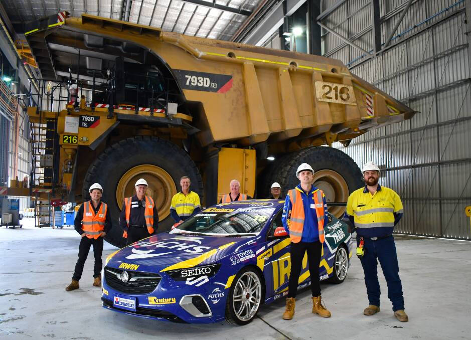 FAST AND FURIOUS: Mark 'Frosty Winterbottom, Australian professional racing driver, (front left) with members of the Fuchs lubricants and Glencore teams at Glencore's Mangoola Open Cut operation on April 28.