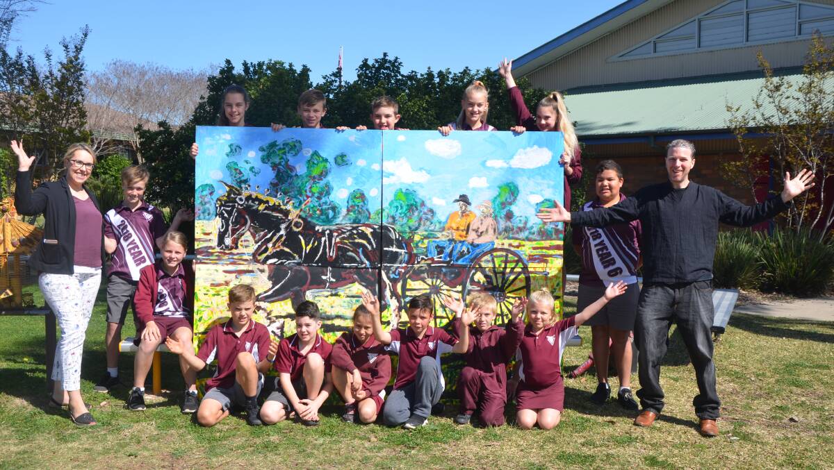 Muswellbrook South Public School students welcoming back A Journey Home with artist Andrew Davis.