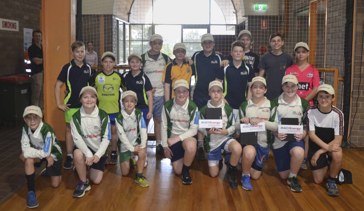 SCORE: Muswellbrook Junior Cricket Club members show off their new hats and iPads at training.
