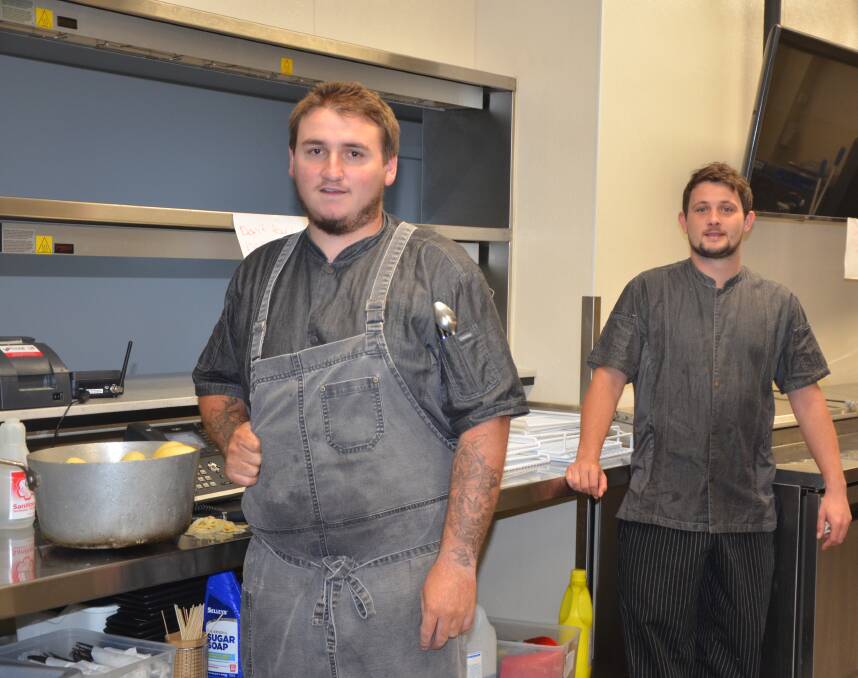 KEEP COOKING: Muswellbrook Workers' Club kitchen staff Russell Fenn and Daniel Howe will play a key role in providing food for Muswellbrook's vulnerable residents.