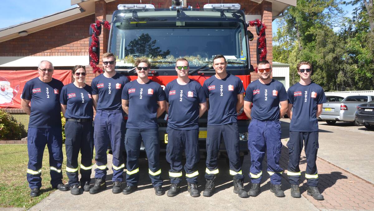 CHRISTMAS SPIRIT: The Fire and Rescue NSW Station 392 Muswellbrook crew members are eager for this year's annual Lolly Run.