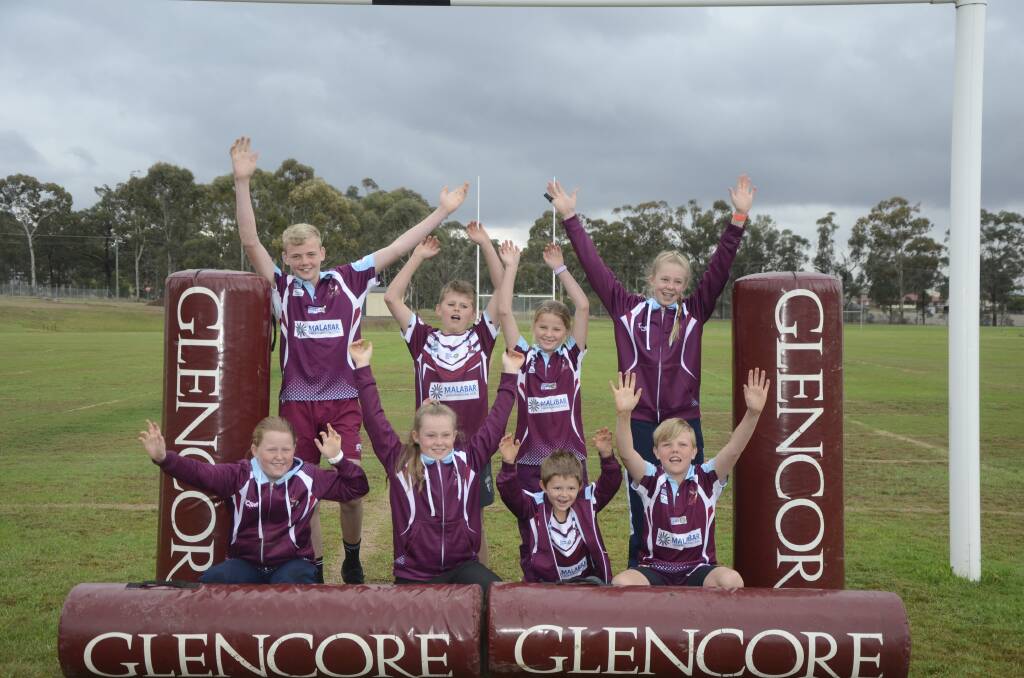 NEW STUFF: The Denman-Sandy Hollow Junior Rugby League Club will enjoy their new posts, just like they enjoyed their Glencore grant-funded tackle bags.