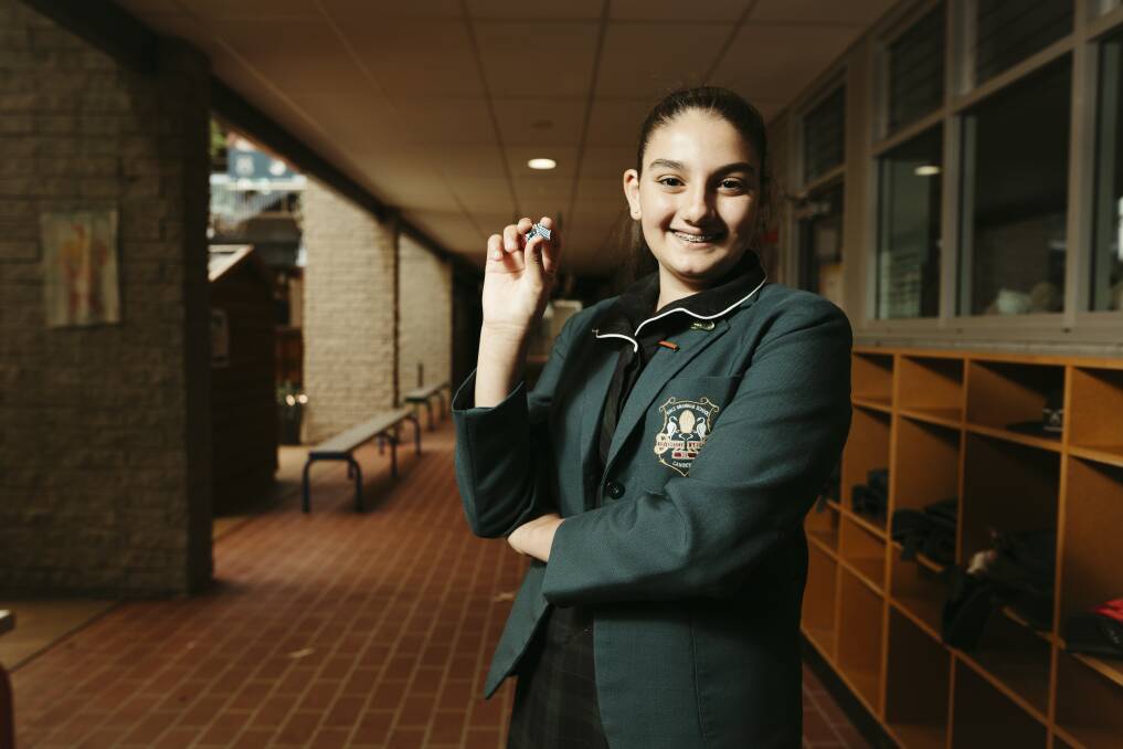 Canberra Girls Grammar School student Anatasia Maleganeas with one of her badges. Picture: Dion Georgopoulos