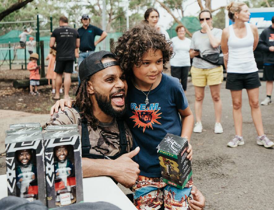 Patty Mills visited the south coast earlier this year to visit fire-affected regions. Picture: Luke Currie-Richardson