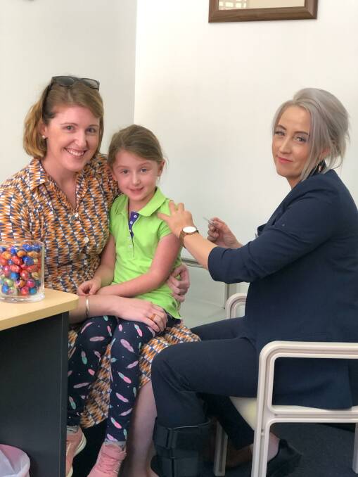 Family affair: Patient Brooke with daughter Molly and Nurse Karina at Brook Medical Centre.